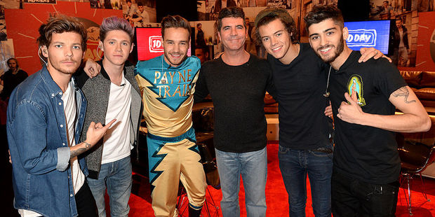 Louis Tomlinson, Niall Horan, Liam Payne, Simon Cowell, Harry Styles, and Zayn Malik. Photo / Getty Images