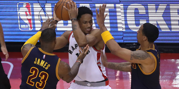 DeMar DeRozan defended by LeBron James and Channing Frye during the NBA Playoffs. Photo / Getty Images