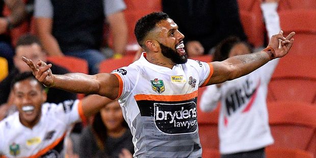 Joshua Addo-Carr of the Tigers celebrates scoring a try against the Brisbane Broncos. Photo / Getty