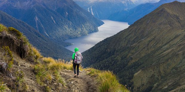 A woman hiking the Kepler Track. More than 60 per cent of tracks on NZ's Great Walks are not up to standard. Photo / Supplied