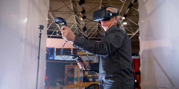 Stunt director Guy Norris playing a game using HTC Vive. Photo / Dean Purcell