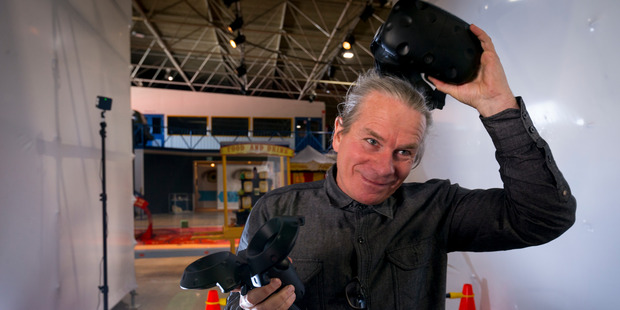 Stunt actor Guy Norris used HTC Vive to play a game during the virtual reality conference. Photo / Dean Purcell