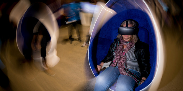 Documentary Editor Miriama Toms try's out the Samsung VR set-up during the virtual reality conference held at MOTAT. Photo / Dean Purcell
