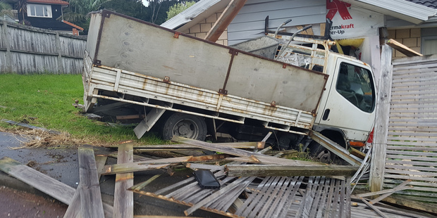 The truck crashed into the living room of a house in Henderson, West Auckland, this afternoon. Photo / Daniel Hines