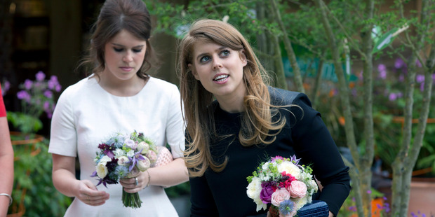 Britain's Princess Beatrice, right, and Princess Eugenie walk through the RHS Greening Grey Britain Garden by Anne-Marie Powell at the 2016 Chelsea Flower Show in central London. Photo / AP