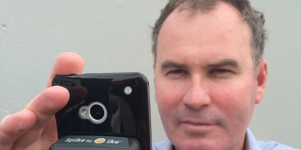 IkeGPS CEO Glenn Milnes holds the company's Spike smartphone measuring tool. Photo / File