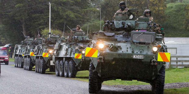 Soldiers in a convoy of LAVs arriving to help in the search for Alex Fisher. Photo / Mark Mitchell
