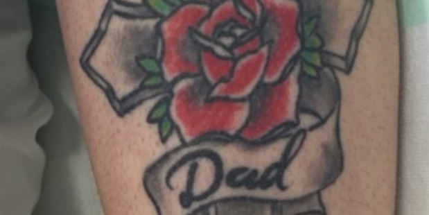 A total of five people have now been charged in relation to a woman, with the pictured tattoo, who was found bound and gagged on the side of an Auckland Road.