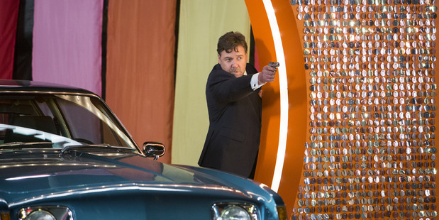 Russell Crowe blasts his way through the 70s decor of Nice Guys (Supplied)