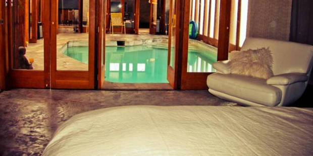 One of the two bedrooms opens directly onto the heated indoor pool - perfect for a late-night dip. Photo / Airbnb