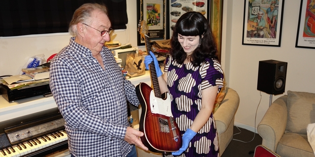 Midge Marsden hands over his Jansen Beatmaster to the Auckland Museum's Jane Groufsky.