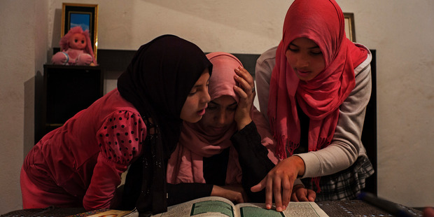 Olfa Rahmouni with her daughters Taysir, 11 and Aya, 13. Her older daughters Rahma, 17, and Ghofran, 18, joined Isis and were later captured by a Libyan militia. Photo / Washington Post