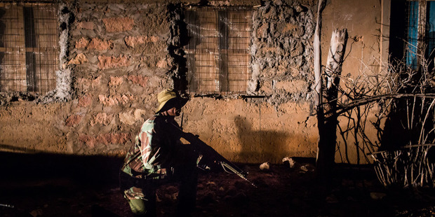 A Home Guard demonstrates the training he's received at the local police training camp. Photo / Foreign Policy