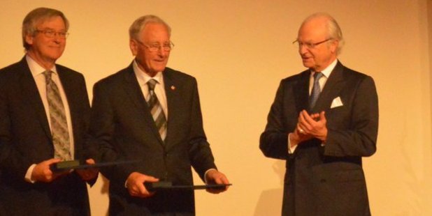 Roy Kerr, centre, along with Professor Roger Blandford of Stanford University, receive the Crafoord Prize from the King of Sweden, HM King Carl XVI Gustaf, right. Photo / Laura Pishief
