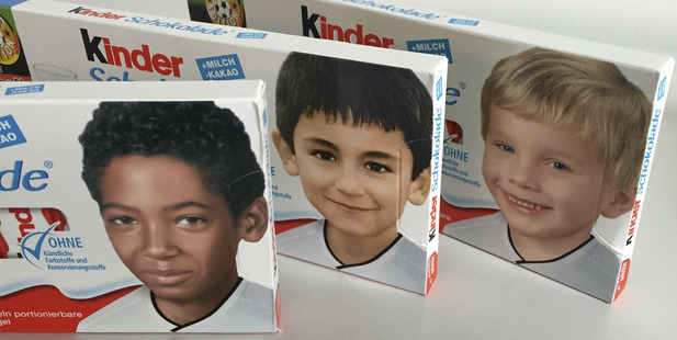 Packages of a popular chocolate bar with childhood pictures of German national players, from left, Jerome Boateng, Ilkay Gundogan and Polish born Lukas Podolski.