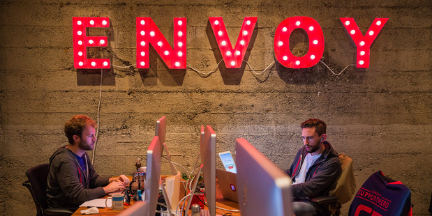 Employees of Envoy can be seen working in their San Francisco office space. The 30-person company enables businesses to register visitors using iPads instead of handwritten visitor logs. MUST CREDIT: