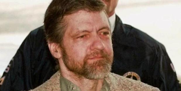 Unabomber suspect Theodore (Ted) Kaczynski being escorted by US marshalls after a court hearing in 1996. Photo / AP