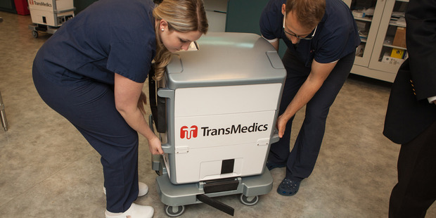 Two technicians carry the Transmedics Organ Care System at Transmedics in Massachusetts. Photo / Washington Post