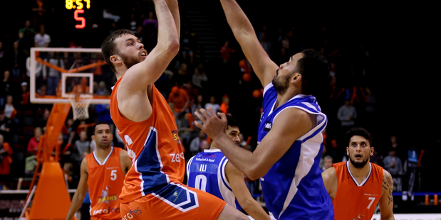 Nick Kay of the Sharks attempts a shot while guarded by Tai Wesley of the Saints. Photo / Photosport