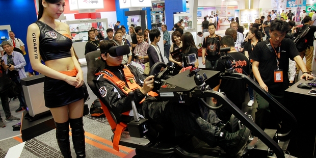 Video game enthusiasts got a taste of virtual reality in Taipei this week, but experts say the technology has a range of uses. Photo / AP