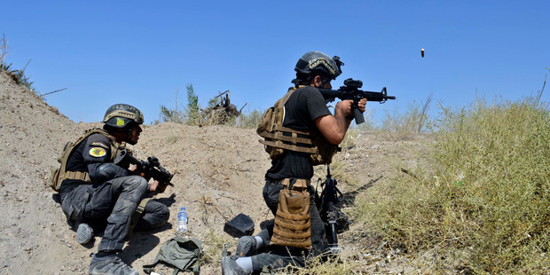 Iraqi counterterrorism forces face off with Isis (Islamic State) militants on the southern edge of Fallujah, Iraq. Photo / AP