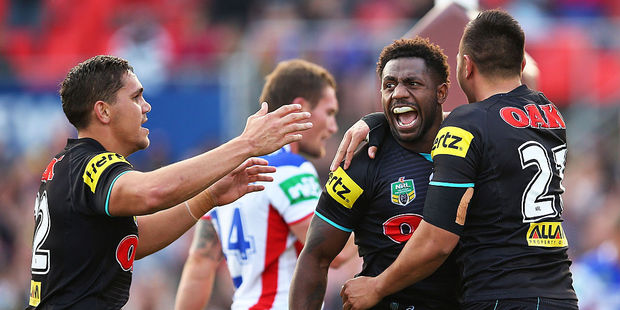 James Segeyaro (centre) celebrates with Panthers team mates. Photo / Getty