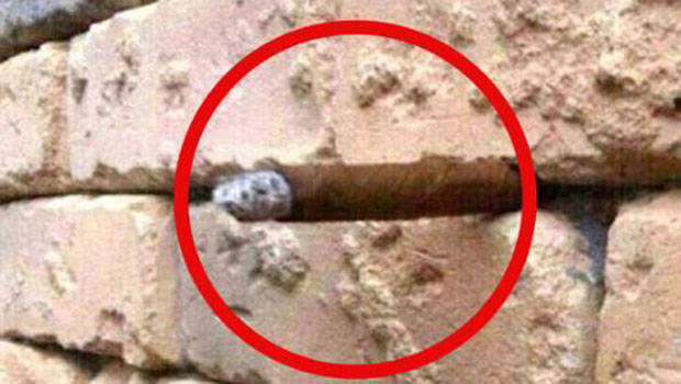 Identified: The image has gone viral as people have spotted a hidden optical illusion of what appears to be a cigar poking out from the wall.