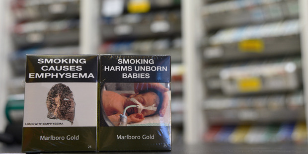 Examples of plain-packaging cigarette packets in Australia. Photo / Getty