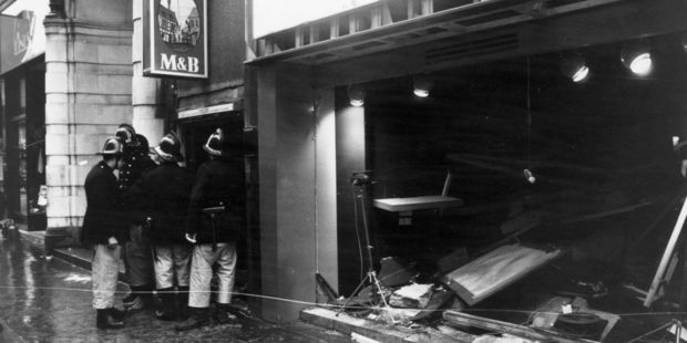 22nd November 1974: Firemen survey the damage outside the Birmingham pub, 'Tavern in the Town', after an IRA bomb blast. Photo / Getty