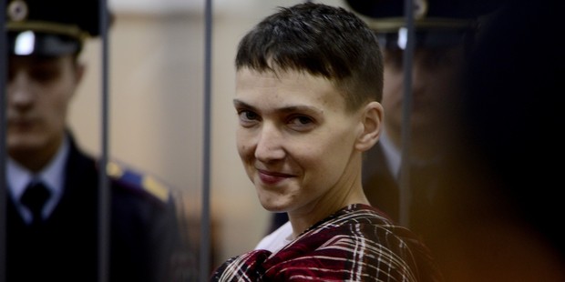 Ukrainian air force pilot and member of the Ukrainian Parliament Nadia Savchenko stands in a cage at a court room in Moscow. Photo / Getty