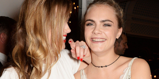 Amber Heard and Cara Delevingne. A source claims they were more than just good friends. Photo/Getty