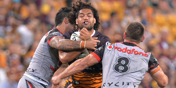 Adam Blair of the Broncos takes on the Warriors defence during the teams' round two clash. Photo / Getty