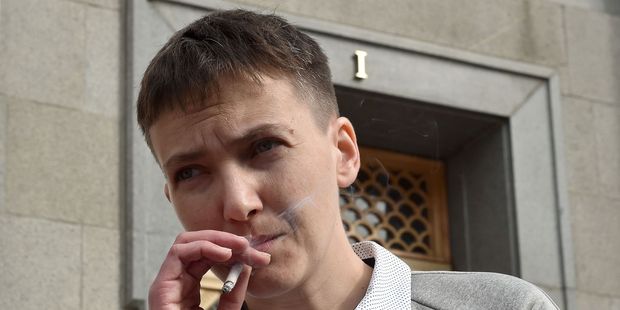 Ukrainian pilot Nadiya Savchenko smokes a cigarette in front of the Ukrainian Parliament in Kiev. Photo / Getty