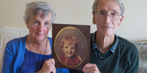 Dave and Marlena Peacock with a portrait of their son Ashley, who has spent more than five years locked in virtual seclusion at a mental health unit. Photo / Mark Mitchell