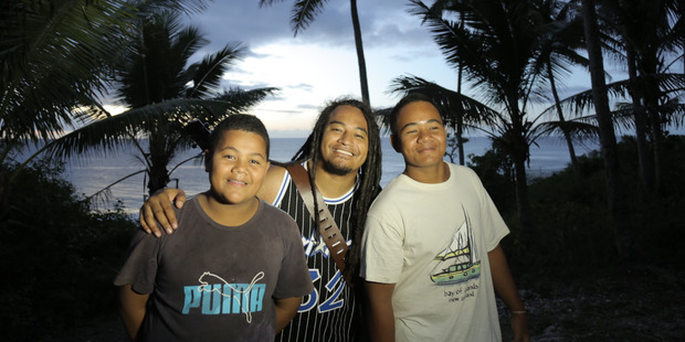 Mal Lakatani, middle, with Niuean locals. Photo / Mal Lakatani