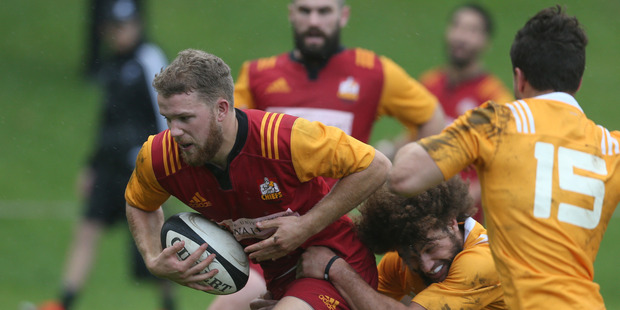 BOP Emerging Players first-five Dan Hollinshead takes a tackle against the NZ Under-20 squad at Blake Park yesterday. Photo / John Borren