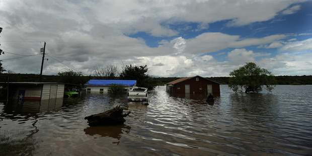 Houses sit in flooded lake waters at Lake Cisco, Texas. Photo / AP