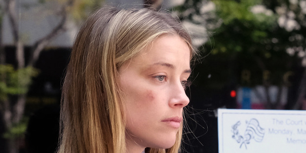 Amber's friend says she's been a witness to the effects of Johnny Depp's violence before. Photo / AP