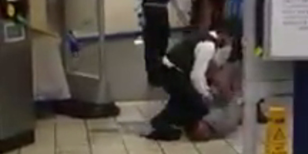 Still from smartphone video shot at Leytonstone Underground Station show Muhiddin Mire being arrested following the alleged attack. Photo / Supplied