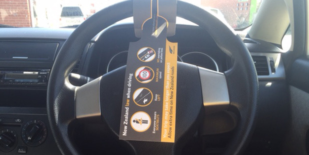 An instruction sheet for foreign drivers, attached to the steering wheel of a rental car. Photo / Tina Trenkner-Meade