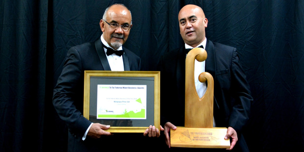 Waipapa Pine head Shane Horan (right) gets his company's awards from Minister of Maori Development Te Ururoa Flavell. Photo / C. Horsford Photography