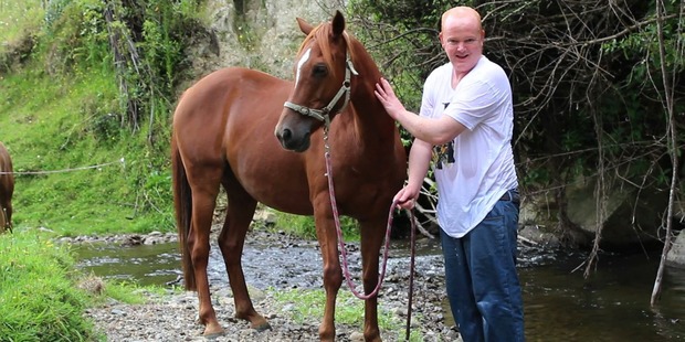 Last year Ashley completed five sessions of equine therapy. He loves nature and the outdoors. The funding for the treatment was discontinued. Photo / Supplied