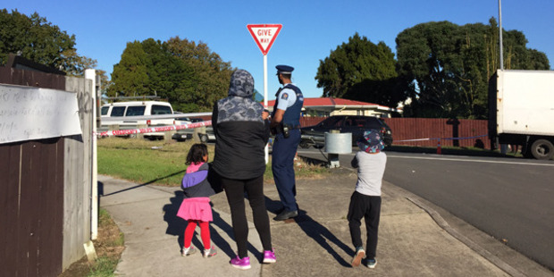 Members of the public - possibly family, are being allowed into the cordoned off area. Photo / Susan Strongman