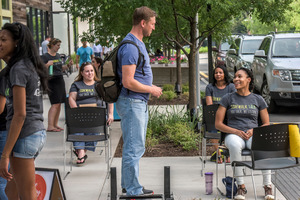 Volunteer Kari Scott, right, chats with a man passing by. Photo / Washington Post