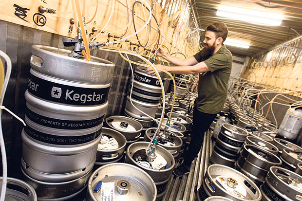 Inside one of the refrigerated containers providing on-tap beer for the festival. Photo / GABS