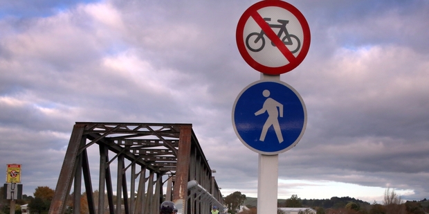 MYSTERY MESSAGE: The Aramoho rail bridge is open to cyclists, despite what the sign says. PHOTO/STUART MUNRO