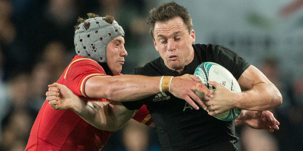 Ben Smith is tackled by Jonathan Davies. Photo / Greg Bowker
