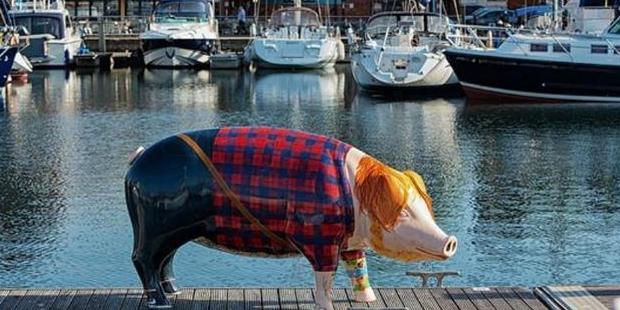 The flannel-wearing, red-haired pig is the pork of the town with fans trotting to the statue in droves to snap a swine selfie. Photo / Suffolk City Council Twitter