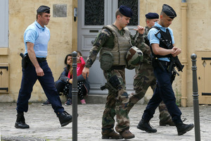 Soldiers and police keep guard near the England soccer team hotel in Chantilly, France. Photo / AP