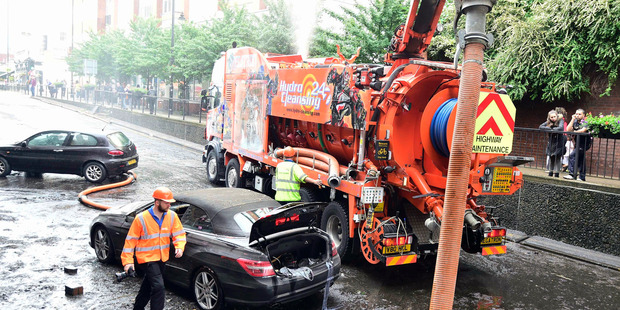 The aftermath of a flash flood following torrential rain, in Wallington, England. Photo / AP